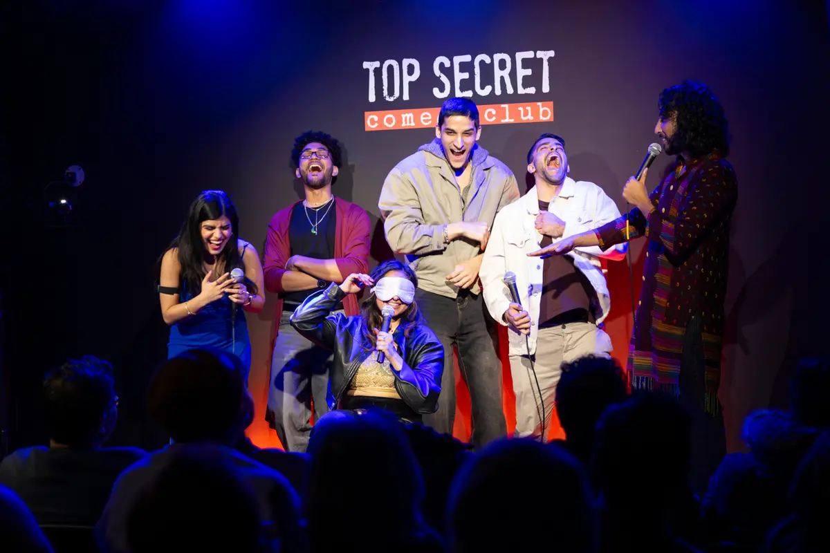 Contestants and hosts on stage at Garam Masala Dating